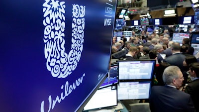 Unilever logo above a trading post on the floor of the New York Stock Exchange, March 15, 2018.