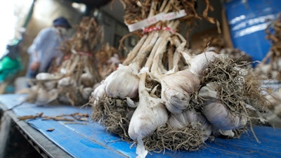 Bulbs of garlic are displayed at a shop in Seoul, Aug. 3, 2022.