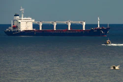 A boat with Russian, Ukrainian, Turkish and U.N. officials heads to the Sierra Leone-flagged cargo ship Razoni off the coast of Istanbul, Aug. 3, 2022.