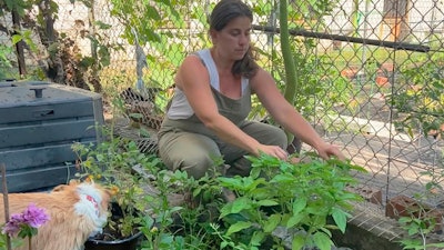 Theresa Fiumano-Rhatigan in her garden in Brooklyn, New York, Aug. 8, 2022.