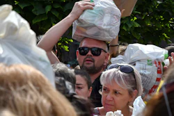 Residents gather to hand out donated items for territories occupied by Russia, Zaporizhzhia, Ukraine, Aug. 14, 2022.