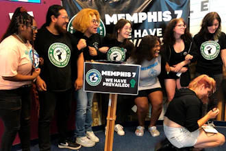A group of fired Starbucks employees celebrate the result of a vote to unionize one a Memphis location, June 7, 2022.