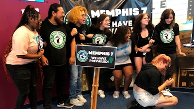 A group of fired Starbucks employees celebrate the result of a vote to unionize one a Memphis location, June 7, 2022.