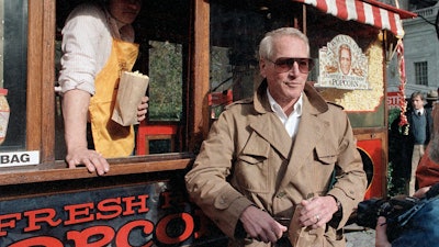 Paul Newman donates a 'Newman's Own Popcorn' stand to the city of New York, Nov. 15, 1984.