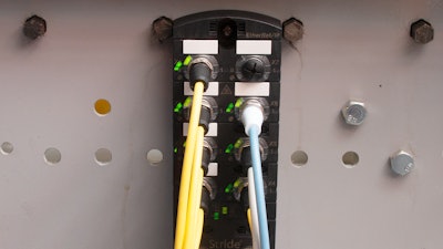 Figure 2: Shown here installed on the side of a conveyor, an AutomationDirect STRIDE IO-Link master module is a convenient way to connect photoeyes, solenoids, buttons, and beacons as controller I/O. These modules are easily daisy-chained down the length of a conveyor, minimizing wiring.