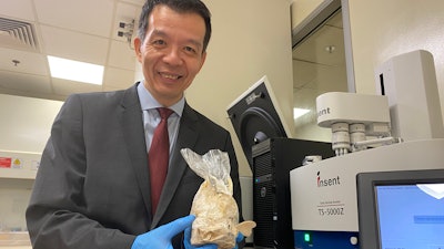 Professor William Chen, director of NTU’s Food Science and Technology program, holds a freshly sprouted oyster mushroom.