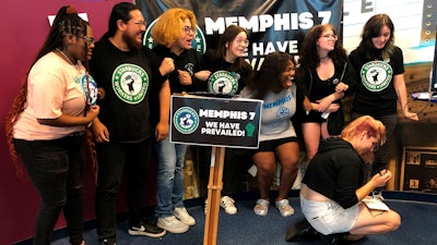 A group of fired Starbucks employees celebrate the result of a vote to unionize one of the coffee company's locations, Memphis, June 7, 2022.