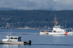 A U.S. Coast Guard boat and a Kitsap Co. Sheriff's Dept. boat search the area near Freeland, Wash., Sept. 5, 2022.