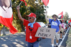 Asunción Ponce, left, marches with fellow members of the United Farm Workers near Walnut Grove, Calif., Aug. 24, 2022.