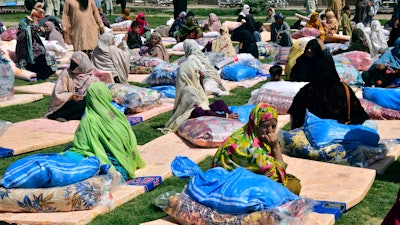 Flooding victims receive aid in Quetta, Pakistan, Sept. 11, 2022.