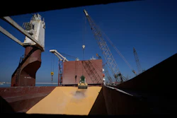 Trucks being filled with Ukrainian corn from the ship AK Ambition at Tripoli seaport in Tripoli, Lebanon, Sept. 26, 2022.