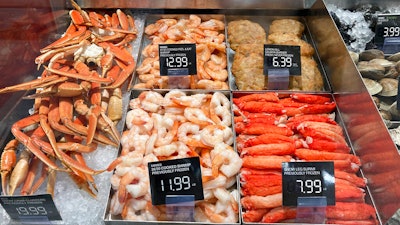 Fresh seafood is shown for sale at a grocery store, Wednesday, July 27, 2022, in Surfside, Fla. Inflation at the wholesale level jumped 8.7% in August from a year earlier, a slowdown from July yet still a painfully high level that suggests prices will keep spiking for months to come.