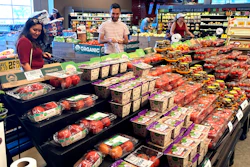 People shop at a grocery store in Glenview, Ill., July 4, 2022.