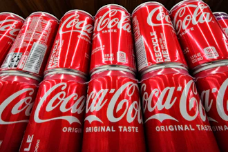 Coca-Cola cans on display at a grocery in Uniontown, Pa., April 24, 2022.