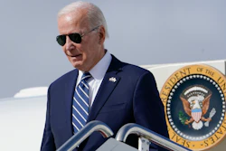 President Joe Biden exits Air Force One as he arrives at Hancock Field Air National Guard Base in Mattydale, N.Y., Thursday, Oct. 27, 2022.