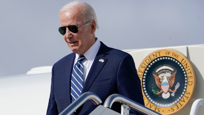 President Joe Biden exits Air Force One as he arrives at Hancock Field Air National Guard Base in Mattydale, N.Y., Thursday, Oct. 27, 2022.