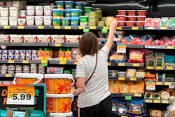 A customer looks at refrigerated items at a Grocery Outlet store in Pleasanton, Calif.,. on Thursday, Sept. 15, 2022. 'Best before” labels are coming under scrutiny as concerns about food waste grow around the world. Manufacturers have used the labels for decades to estimate peak freshness. But “best before” labels have nothing to do with safety, and some worry they encourage consumers to throw away food that’s perfectly fine to eat.