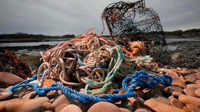 A washed-up lobster trap and tangled line on a beach in Biddeford, Maine, Nov. 13, 2009.