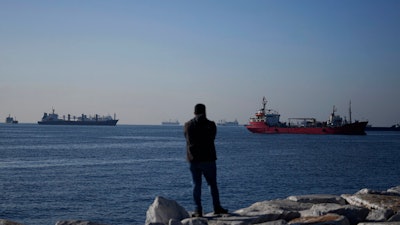 Cargo ships anchored in the Marmara Sea await to cross the Bosphorus Straits in Istanbul, Turkey, Tuesday, Nov. 1, 2022. Turkey's defense minister urged Russia to 'reconsider' its decision to suspend the implementation of the U.N. and Turkish-brokered grain deal in a telephone call Monday with his Russian counterpart, Sergei Shoigu.