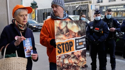 French animal rights activists group L214 protests in front of Agriculture Ministry in Paris, Dec. 7, 2022.