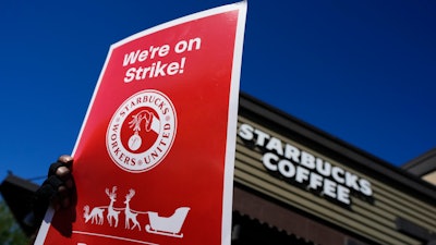 Starbucks employees strike outside their store in Mesa, Ariz., Nov. 17, 2022.