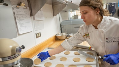 Elizabeth Nalbandian, study first author and WSU food science graduate student, prepares sugar cookies made with quinoa flour for baking.