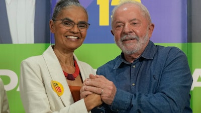 Brazil's former President Luiz Inacio Lula da Silva, right, and congressional candidate Marina Silva campaign in Sao Paulo, Sept. 12, 2022.