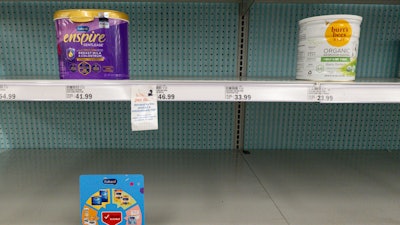Baby formula displayed on mostly empty shelves at a grocery store in Carmel, Ind., May 10, 2022.