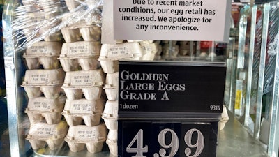 A grocery store in Cheverly, Md., posts a sign to apologize for the increased price of their eggs, Tuesday, Jan. 10, 2023.