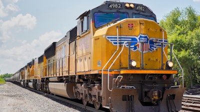 A Union Pacific train travels through Union, Neb., on July 31, 2018. Federal regulators have ordered Union Pacific to make sure a California company gets the grain it needs to prevent millions of chickens from starving while it works to recover from the recent bitter cold and snow. This is the second time in the past year regulators issued an emergency order related to delivery problems at Foster Farms as the railroad struggled with a shortage of crews.