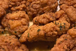 An order of 'boneless chicken wings' rests on a plate, Tuesday, Feb. 7, 2023, in Derry, N.H.