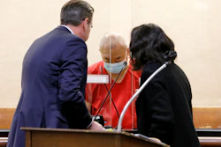 Chunli Zhao, center, appears for a plea hearing with his defense attorney Eric Hove, left, at San Mateo Superior Court in Redwood City, Calif., Feb. 16, 2023.