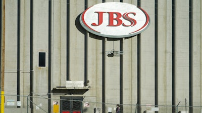 A worker heads into the JBS meatpacking plant in Greeley, Colo., on Oct. 12, 2020.