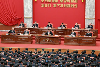 In this photo provided by the North Korean government, North Korean leader Kim Jong Un, front center on stage, attends a meeting of the ruling Workers’ Party at its headquarters in Pyongyang, Feb. 26, 2023.