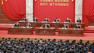 In this photo provided by the North Korean government, North Korean leader Kim Jong Un, front center on stage, attends a meeting of the ruling Workers’ Party at its headquarters in Pyongyang, Feb. 26, 2023.