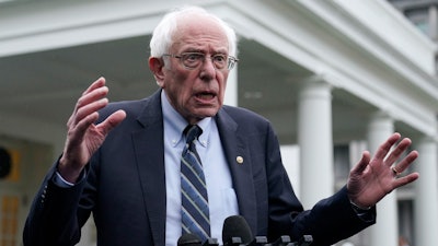 Sen. Bernie Sanders, I-Vt., talks with reporters outside the West Wing of the White House, Jan. 25, 2023.