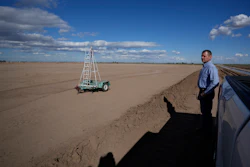 Tom Brundy looks over a field in preparation for planting at his farm near Calexico, Calif., Feb. 28, 2023.