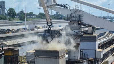 Grain is offloaded from the Eaubonne bulk carrier at the port of Mombasa, Kenya, Nov. 26, 2022.