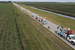 Farmworkers and allies march through agricultural land in Pahokee, Fla., March 14, 2023.