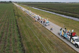 Farmworkers and allies march through agricultural land in Pahokee, Fla., March 14, 2023.