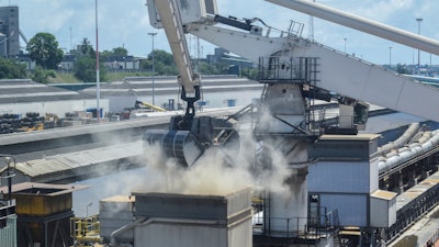 Grain is offloaded from the Eaubonne bulk carrier at the port of Mombasa, Kenya, Nov. 26, 2022.