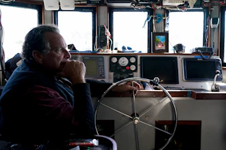 Bob Maharry inside his fishing boat at Pier 45 in San Francisco, March 20, 2023.