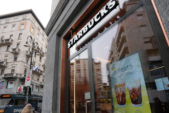 A Starbucks sign advertising the company's Oleato coffee at a shop in Milan, Feb. 27, 2023.