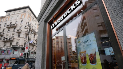 A Starbucks sign advertising the company's Oleato coffee at a shop in Milan, Feb. 27, 2023.