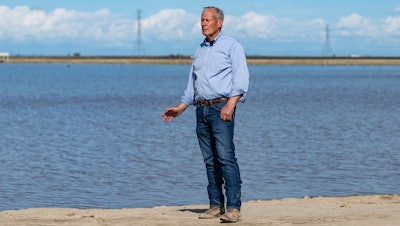 Don Cameron, general manager of Terranova Ranch, in front of a flooded field in Fresno County, Calif., March 13, 2023.