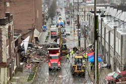 Emergency responders and heavy equipment at the site of a deadly explosion at a chocolate factory in West Reading, Pennsylvania, March 25, 2023.
