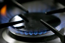 A gas-lit flame burns on a natural gas stove, Jan. 11, 2006.