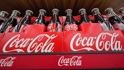 Bottles of Coca-Cola on display at a store in Uniontown, Pa., April 24, 2022.