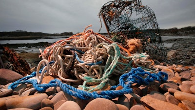A washed-up lobster trap and tangled lines on a beach in Biddeford, Maine, Nov. 13, 2009.