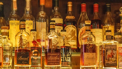 Bottles of Pappy Van Winkle bourbons, top right, at 'Far Bar' in Los Angeles, March 4, 2023.